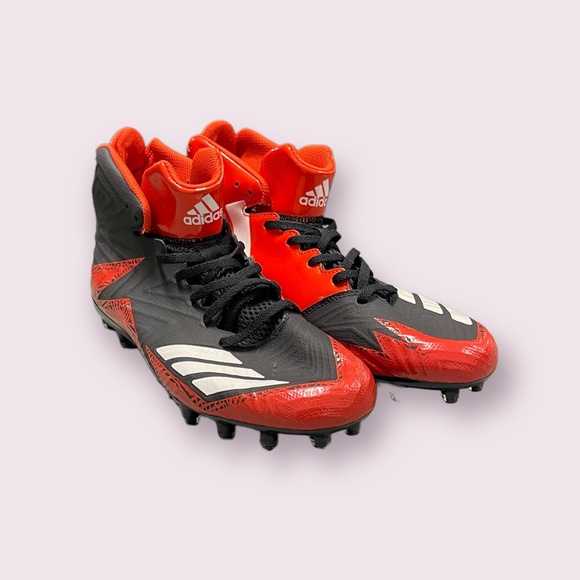 black and orange soccer cleats